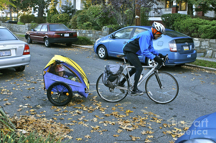 Child Cart Pulled By Fathers Bicycle Photograph by Blair Seitz