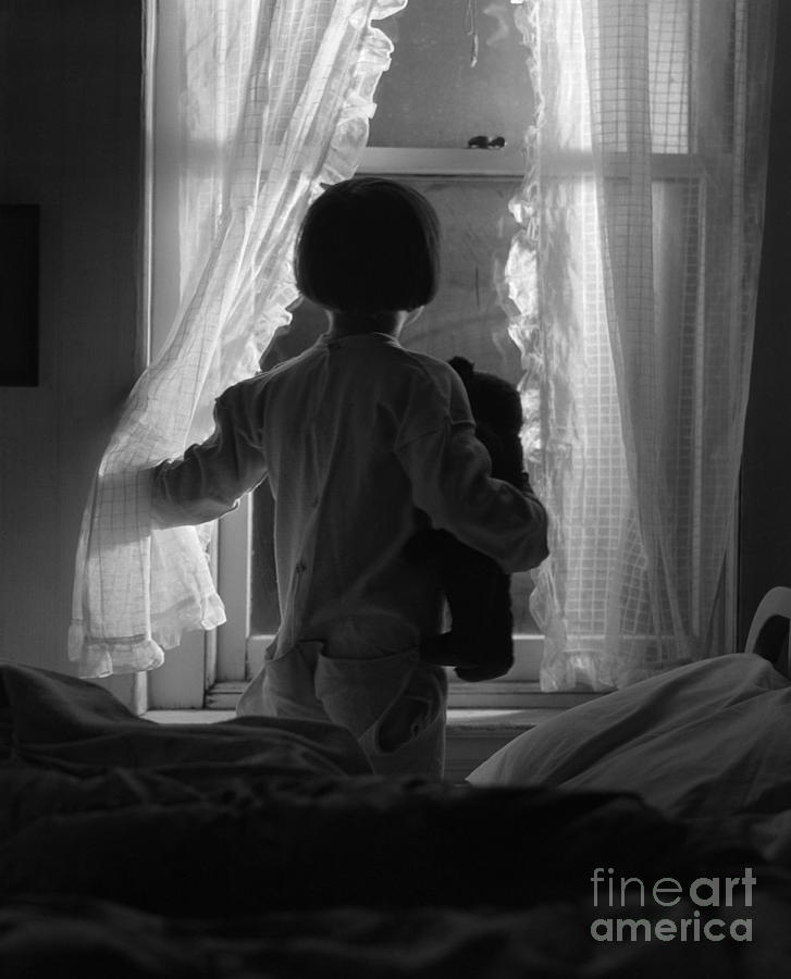 child looking out a window