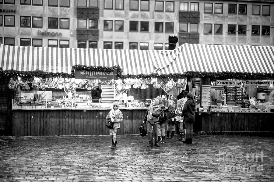Children at the Nuremburg Christkindlesmarkt Photograph by John Rizzuto