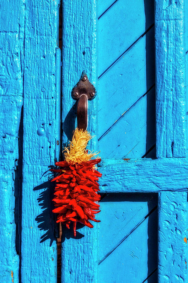 Chilis Hanging On Door Photograph by Garry Gay