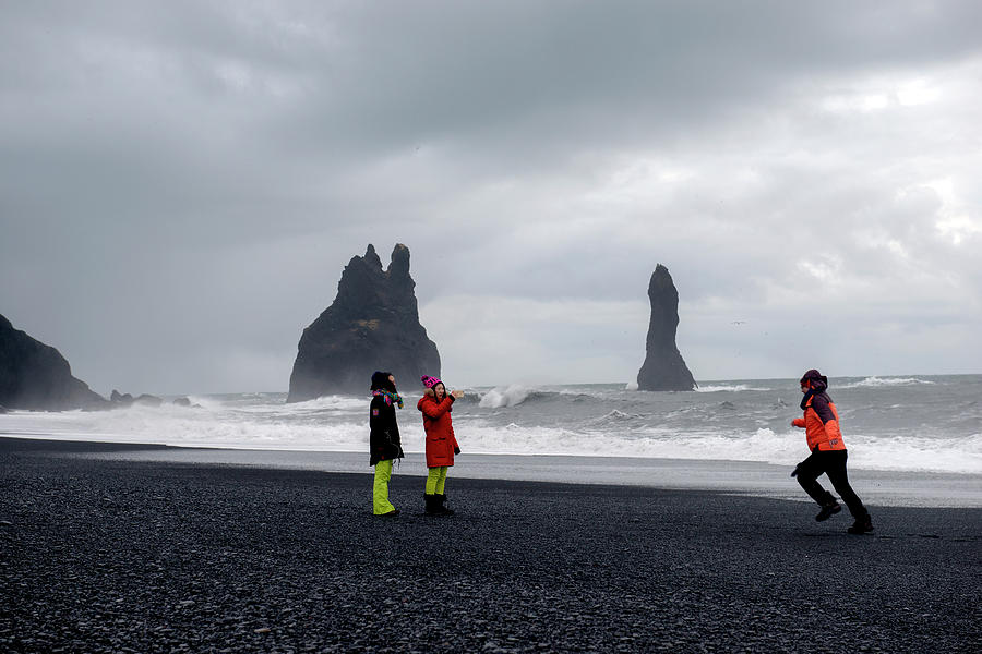 Chinas tourists in Reynisfjara black sand beach, Iceland Photograph by Dubi Roman