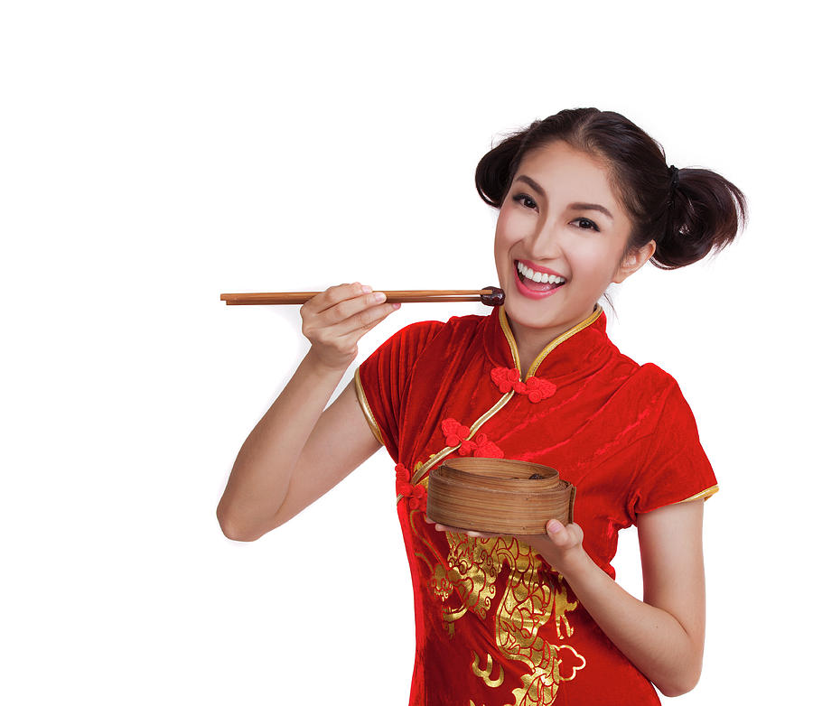 Chinese lady in cheongsam eat a dim sum Photograph by Anek Suwannaphoom