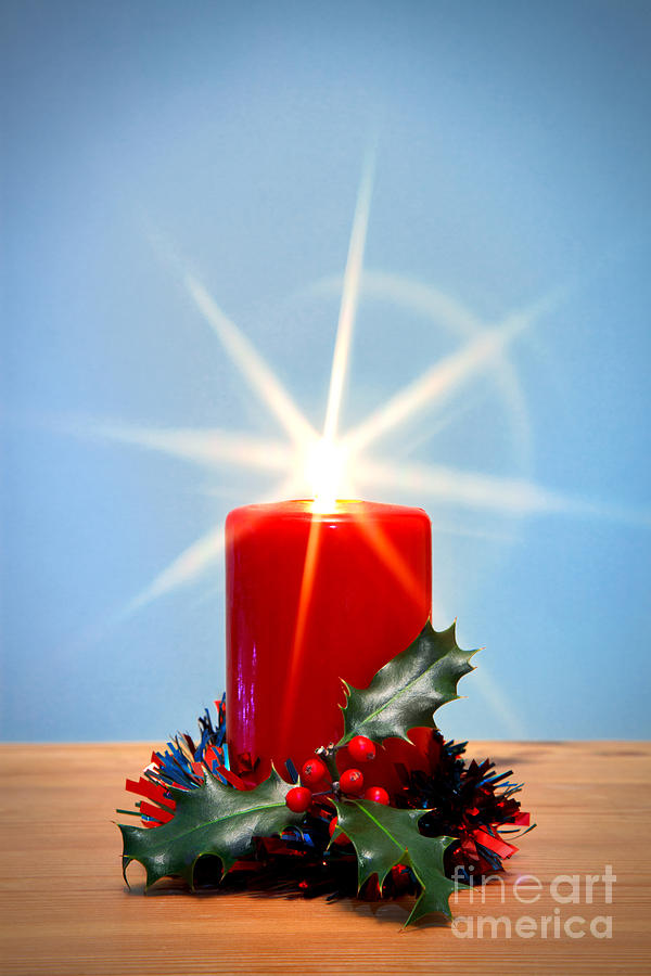 Christmas Photograph - Christmas candle with starburst and holly. by Richard Thomas