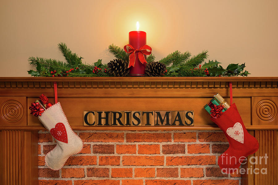 Christmas Fireplace With Stockings And Candle Photograph