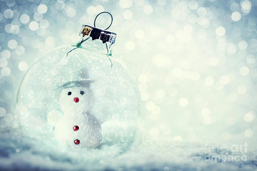 Christmas glass ball with snowman inside. Snow and glitter Photograph by Michal Bednarek