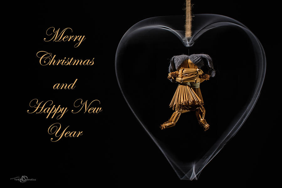 Christmas Greeting With Dancing Straw Dolls In A Heart Photograph