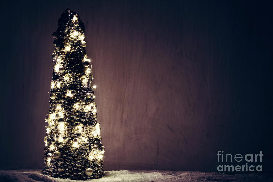 Christmas tree ornament wrapped with lights. Photograph by Michal Bednarek