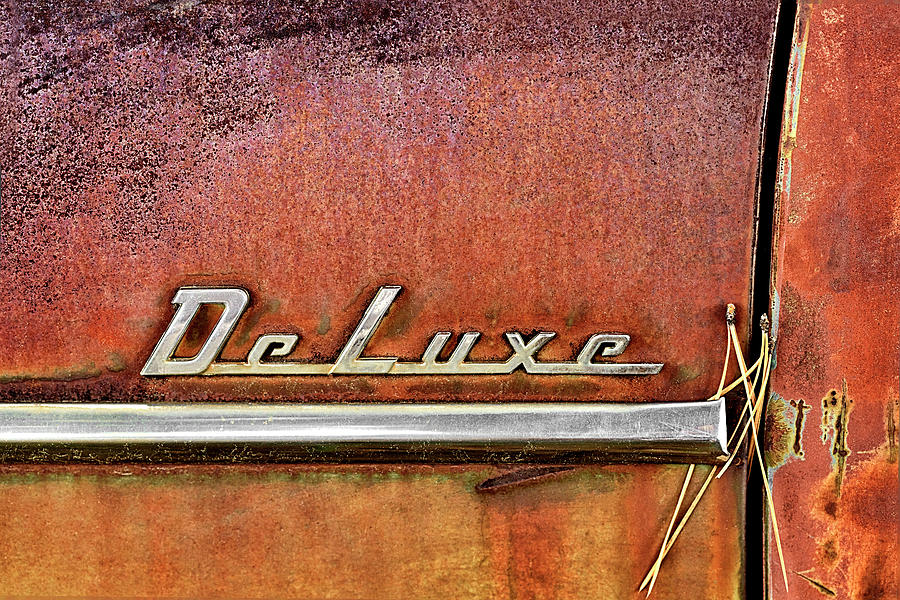 Chrome DeLuxe Words on an Old Rusty Vehicle Photograph by C VandenBerg