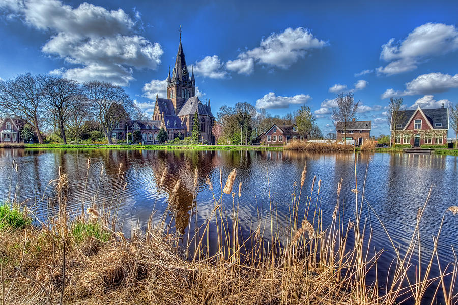 Church Along The Amstel River Photograph by Nadia Sanowar