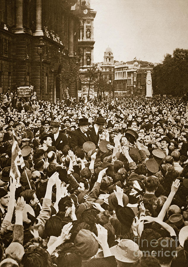 Churchill mobbed in Whitehall on VE Day, 8th May 1945  Photograph by English School
