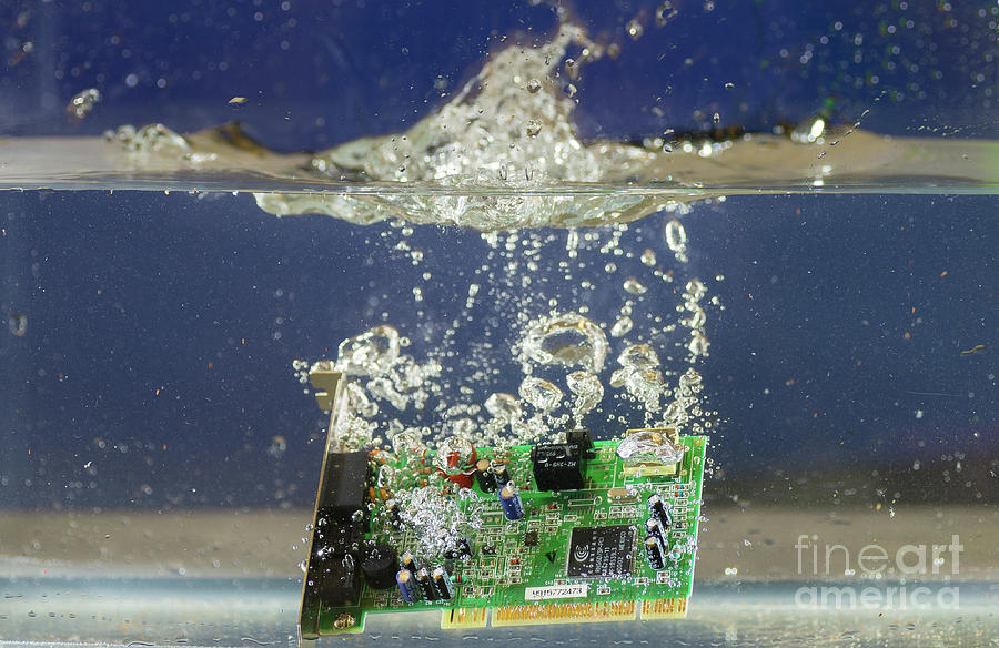 Circuit board submerged in water Photograph by Les Palenik