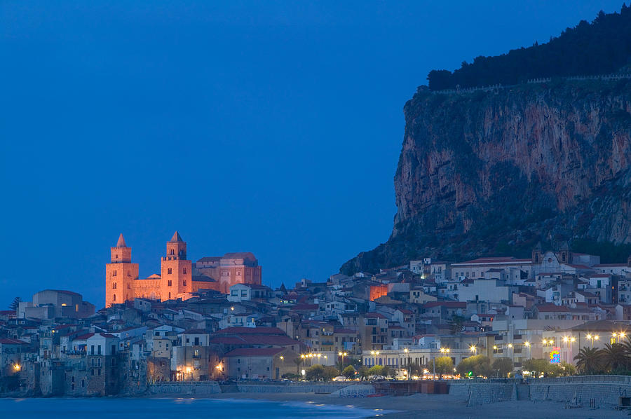 Architecture Photograph - City Lit Up At Dusk, Cefalu, Sicily by Panoramic Images