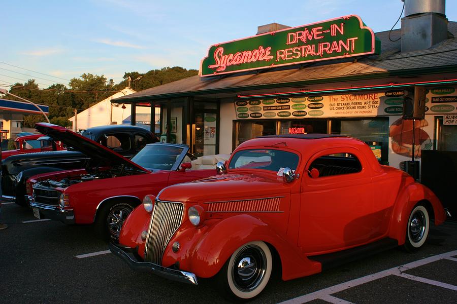 Classic Red Car in front of the Sycamore Photograph by Polly Castor