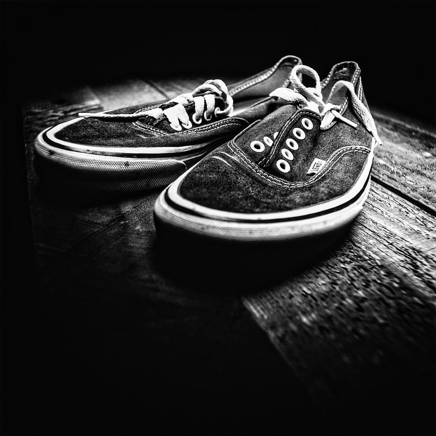 Black And White Photograph - Classic Vintage Skateboard Shoes on Wood in BW by YoPedro