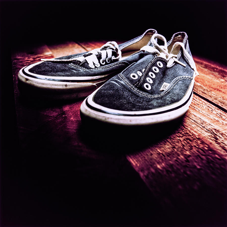 Classic Vintage Skateboard Shoes On Wood Photograph