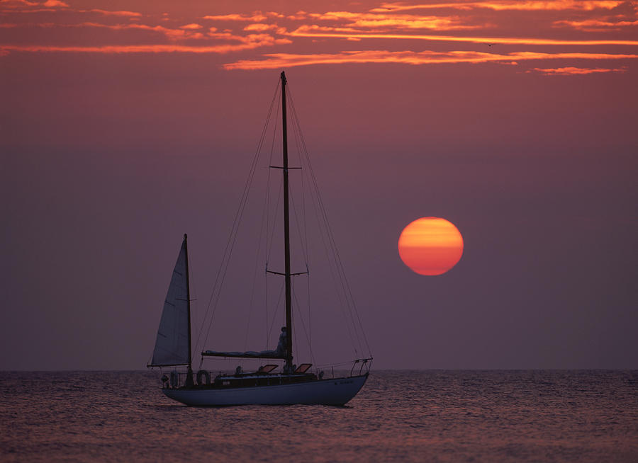 Classic Wooden Yawl Rigged Sailboat In the Sunset Photograph by John Harmon