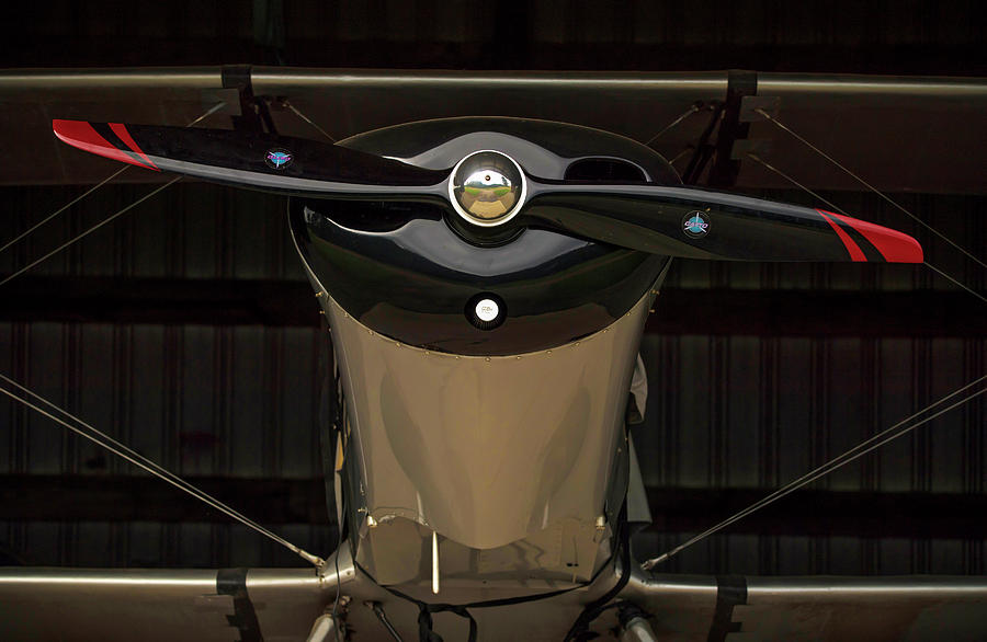 Classy Black Bi-plane Looks Out From A Hanger Photograph