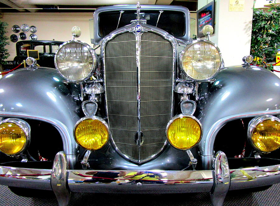 Clear And Amber Headlights Photograph by Randall Weidner