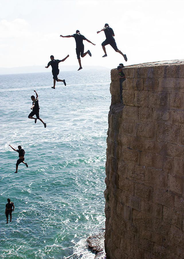 Cliff Diving Photograph by Nicola Nobile