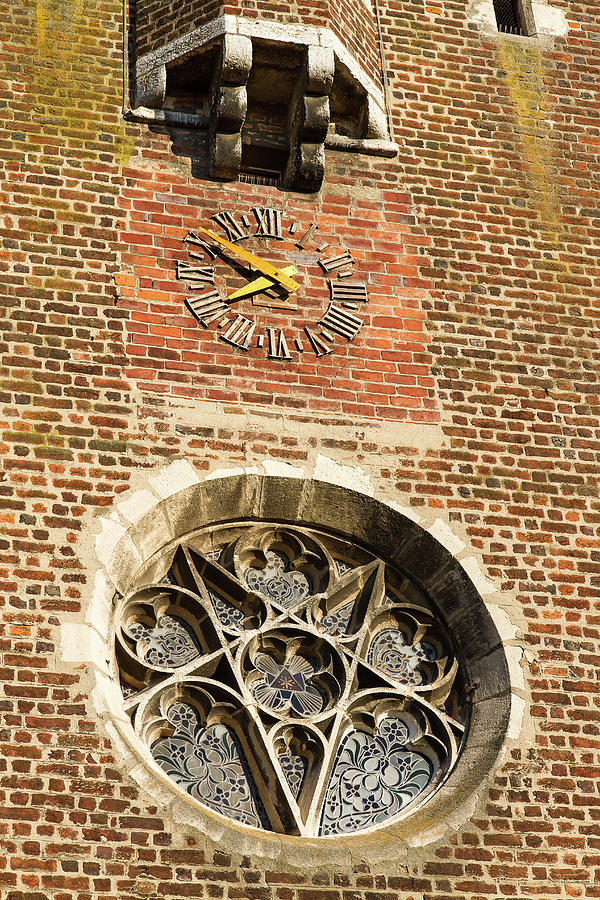 Clock on a church Photograph by Paul MAURICE