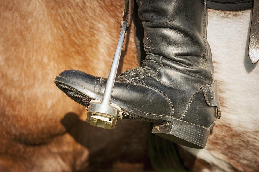Close Up Of A Riding Boot In Stirrups Photograph by Remsberg Inc