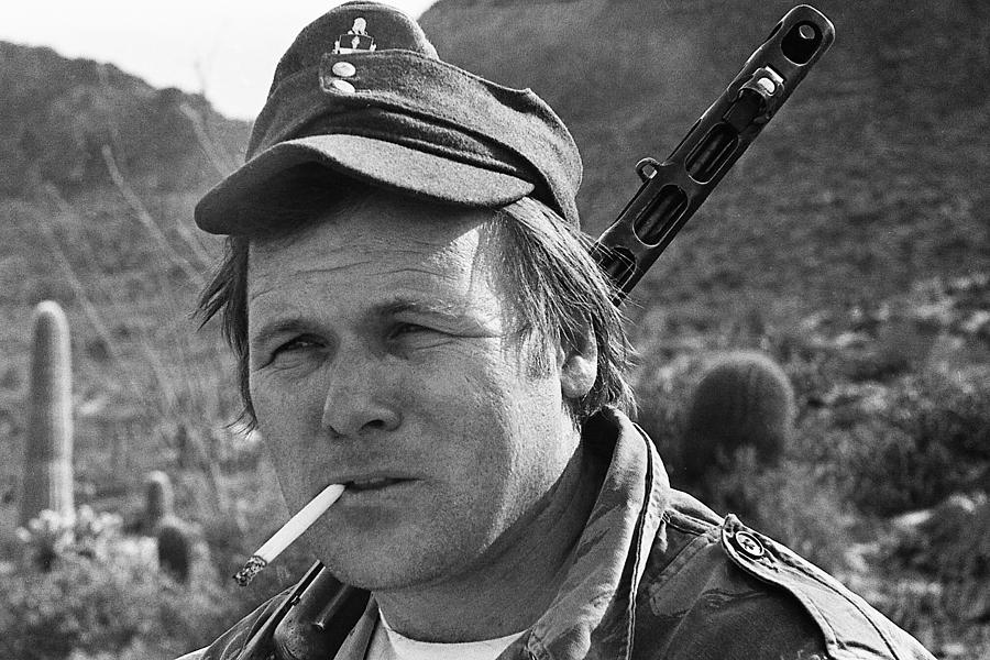 Close up  of  Barry Sadler holding a machine gun Tucson Arizona 1971 Photograph by David Lee Guss