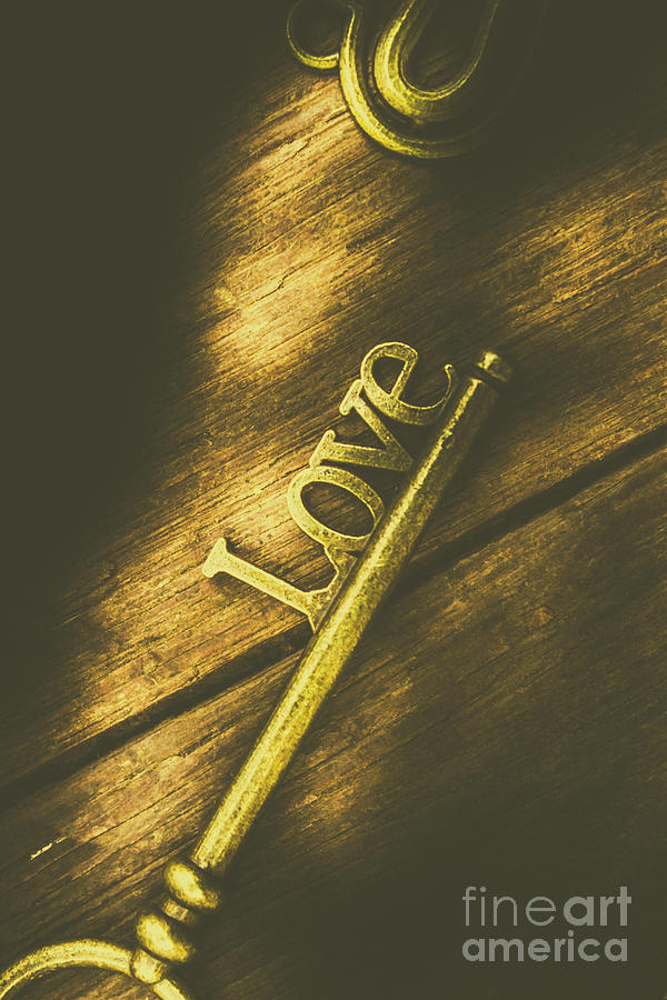 Close-up of gold metal key with love word Photograph by Jorgo Photography