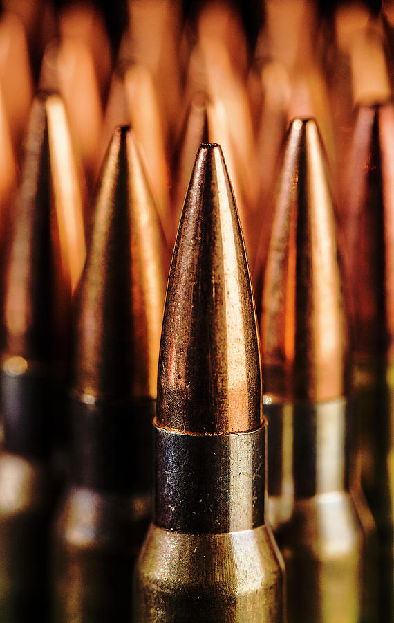 Close up of Standing Rifle Bullets Photograph by Maggie Mccall