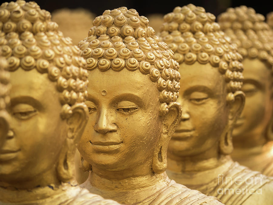 Close-up on head buddha statue, soft focus. Photograph by Tosporn Preede