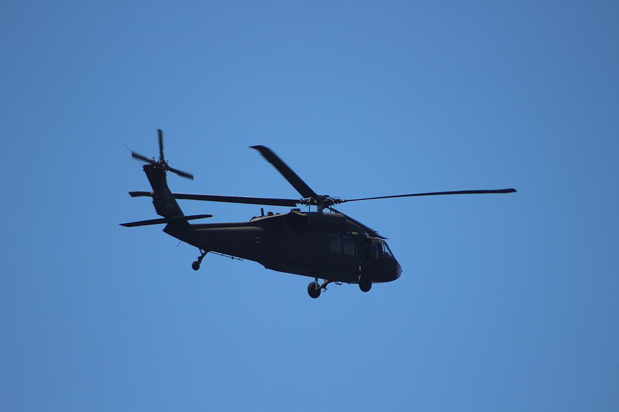 Closeup of Blackhawk Flying Over Pier Photograph by Colleen Cornelius