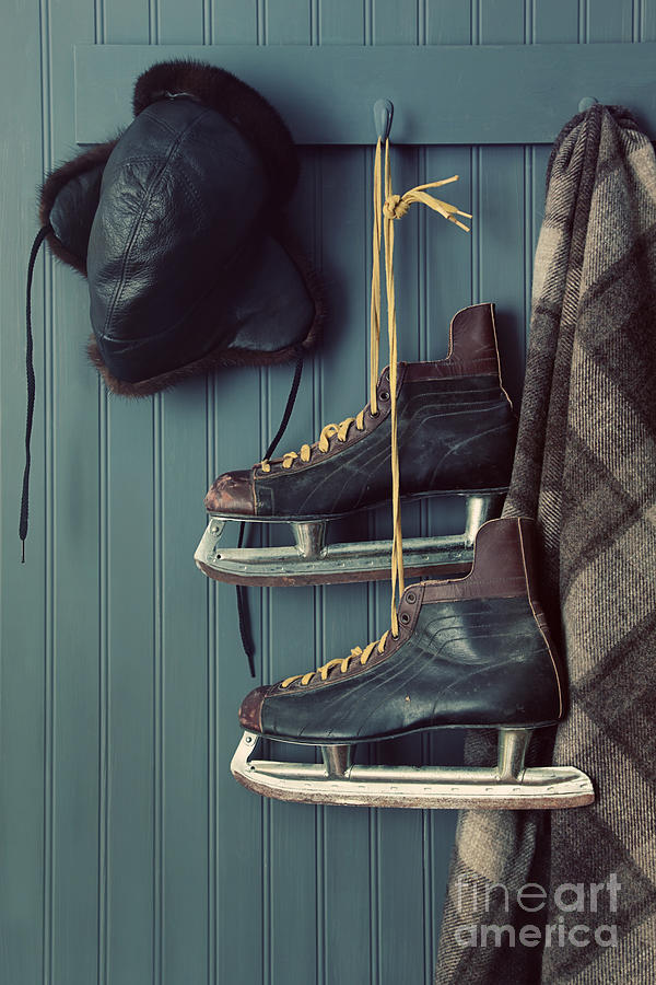 Closeup of old skates on hooks Photograph by Sandra Cunningham