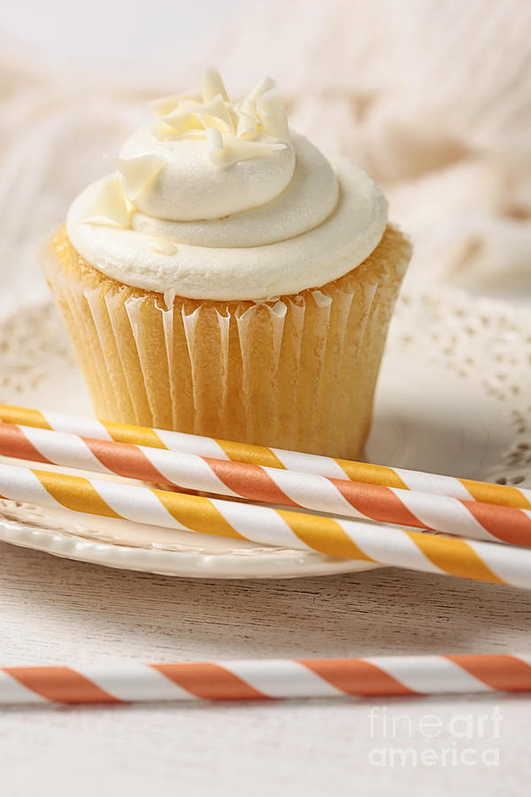 Cake Photograph - Closeup of vanilla cupcake with straws by Sandra Cunningham