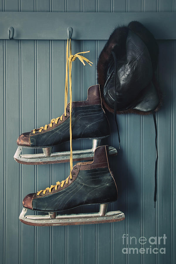 Closeup of vintage mens skates and hat on hooks Photograph by Sandra Cunningham