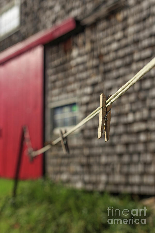 Clothes pins on a clothes line at an old farm Photograph by Edward Fielding