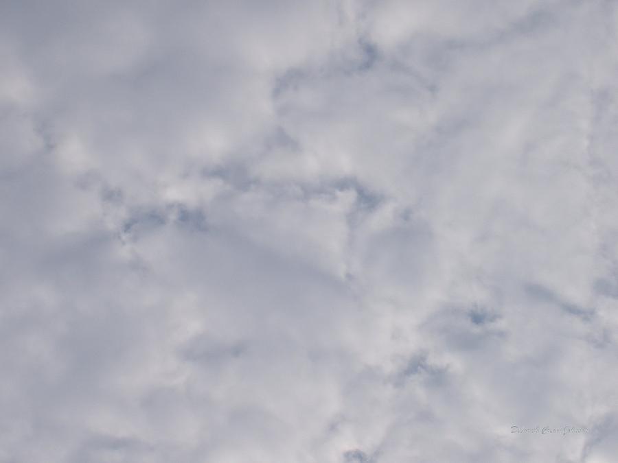 Cloud Mass - Fist holding Arrowhead - look closely Photograph by Deborah  Crew-Johnson