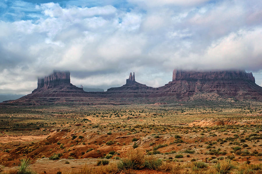 Clouds above Monument Valley  Photograph by Nikolyn McDonald