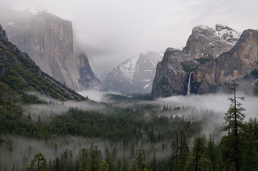 Clouds and fog in Yosemite Valley after a winter rain storm seen ...