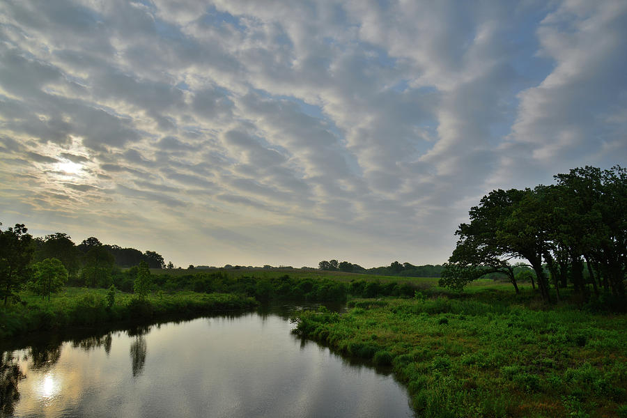 Clouds at Sunrise over Glacial Park Reflected in Nippersink Creek Photograph by Ray Mathis