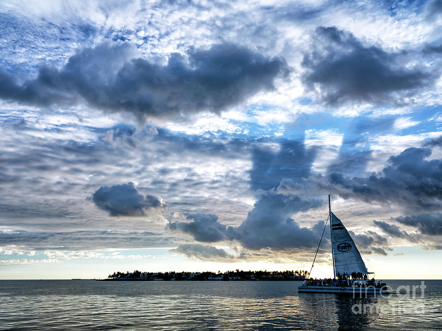 Clouds over Key West Photograph by John Rizzuto
