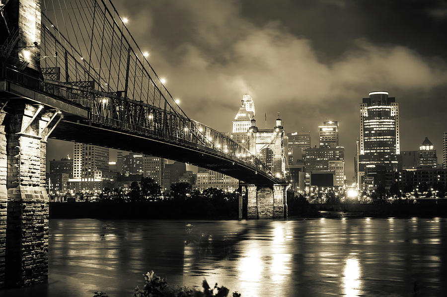 Clouds over the Cincinnati Skyline - Night Cityscape - Sepia Photograph by Gregory Ballos