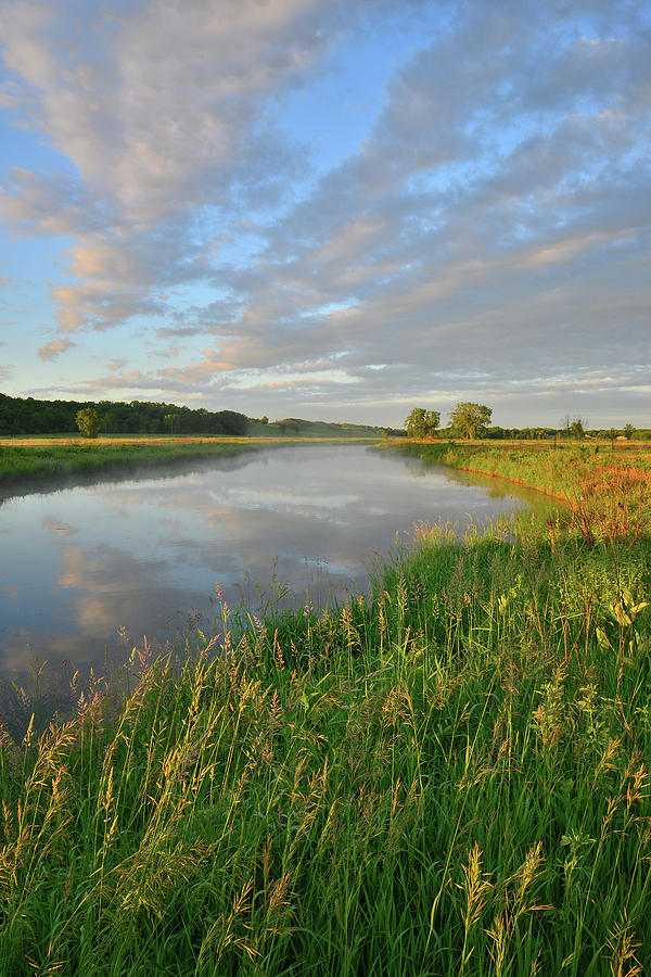 Clouds Reflected in Nippersink Creek at Sunrise in Glacial Park Photograph by Ray Mathis