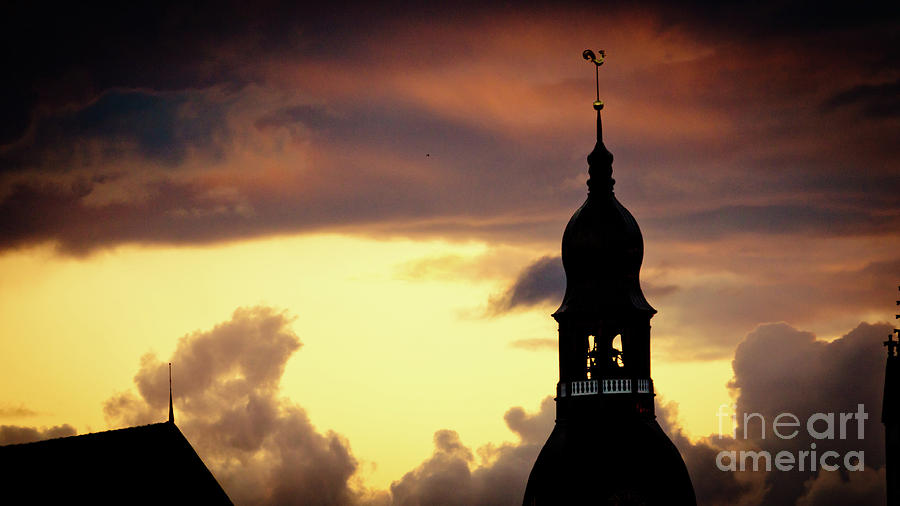 Cloudscape of orange sunset old town Riga Latvia Photograph by Raimond Klavins