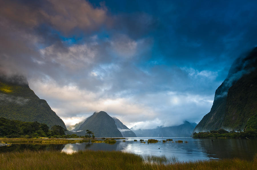 Cloudy morning at milford sound at sunrise Photograph by U Schade