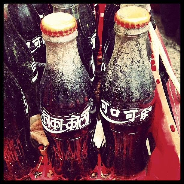 Bottle Photograph - Coca-cola Bottles In Hindi And Chinese by Arnab Mukherjee