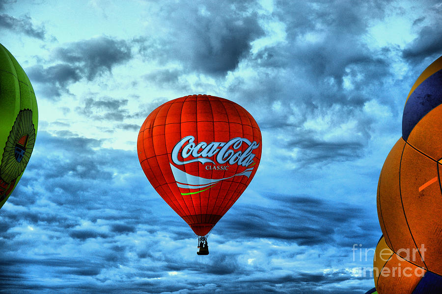 Coca cola rising Photograph by Jeff Swan