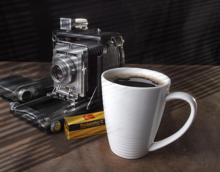 Coffe cup and Camera Photograph by Gary De Capua