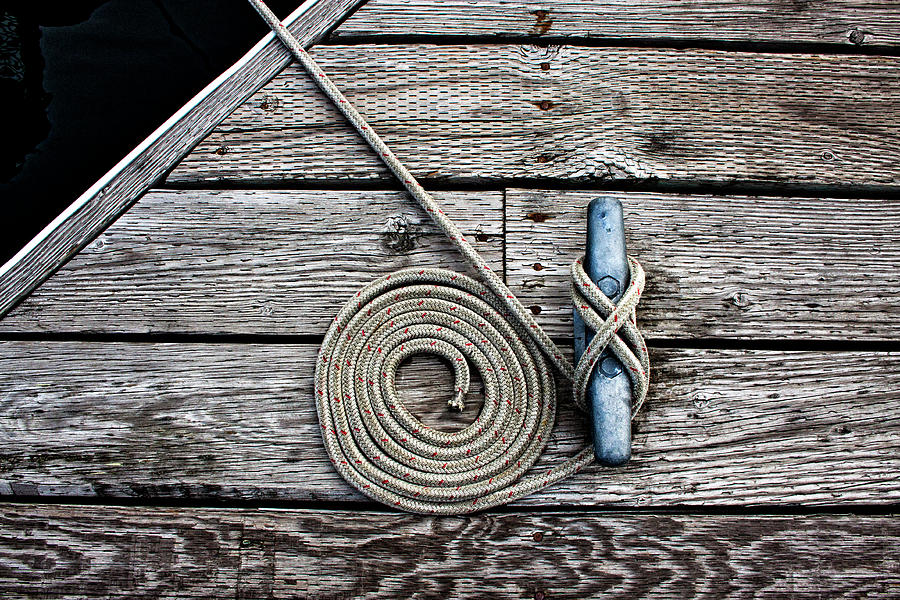 Rope Photograph - Coiled Mooring Line and Cleat by Carol Leigh