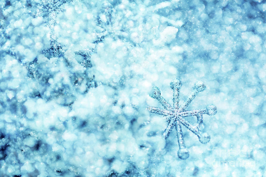 Cold winter glitter background with snowflake Photograph by Michal