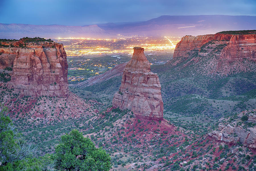 Colorado National Monument Park And City Lights Photograph by James BO Insogna
