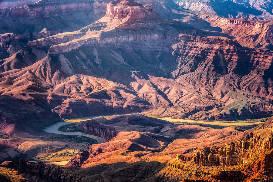 Colorado River winding thru Grand Canyon Photograph by Claudia Abbott